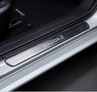фото thumb №1, Оригінальні накладки порогові перед - mazda 2 2020-