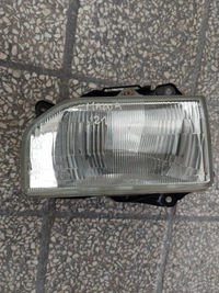 фото thumb №1, Лампа фара моторчик левая передняя mazda 121