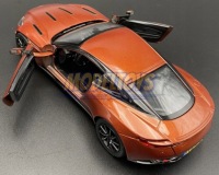 Aston Martin DB11 1:24 модель Motormax 79345 cinnebar orange