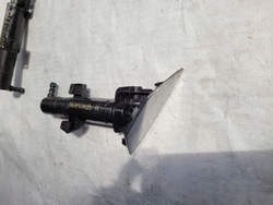 Superb 2 ii рестайлінг - розпилювач фара лівий фото №1