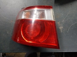 фонарь левый kia CARENS II 02-05