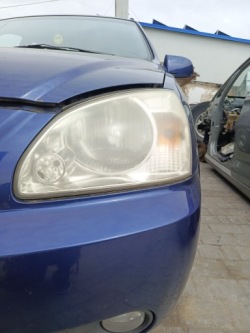 kia CARENS II 2005 Фара левая европа