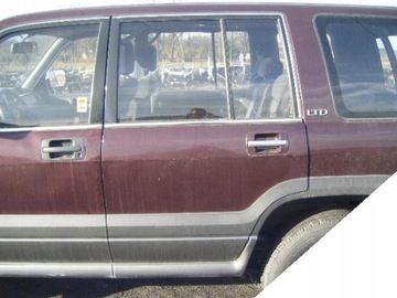 OPEL MONTEREY 91-98 ZAMEK LEWY TYLNY + SIŁOWNIK