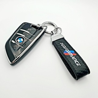 ЭЛЕГАНТНЫЙ ЧЕХОЛ BMW С БРЕЛКОМ PERFORMANCE 