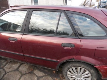 ДВЕРЬ ЗАДНЕЕ ЛЕВАЯ MAZDA 323 BJ 98- 18U BORDOWE КОМПЛЕКТ.