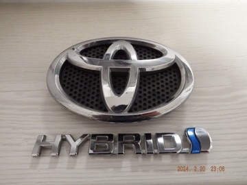 ЭМБЛЕМА ПЕРЕД TOYOTA AURIS II + HYBRID 75312-02120 ОРИГИНАЛ