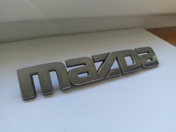 ЗНАЧЕК ЛОГОТИП ЭМБЛЕМА ЗАДНЕЙ КРЫШКИ БАГАЖНИКА MAZDA 121 323 626 3 6 G14S51711 G21B5177