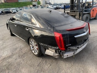 CADILLAC XTS КРЫЛО ЗАДНИЙ ЛЕВЫЙ - ЧЕТВЕРТЬ