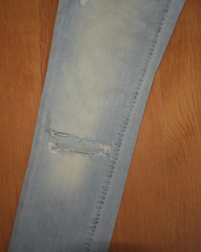Spodnie jeans PLEASE dziury przetarcia XS
