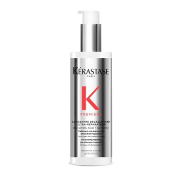 Восстанавливающий концентрат Kerastase Premiere перед мытьем поврежденных волос шампунем.