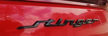 Эмблема чёрная глянцевая, надпись KIA STINGER OE QUALITY