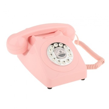 Старомодный настольный телефон розового цвета.