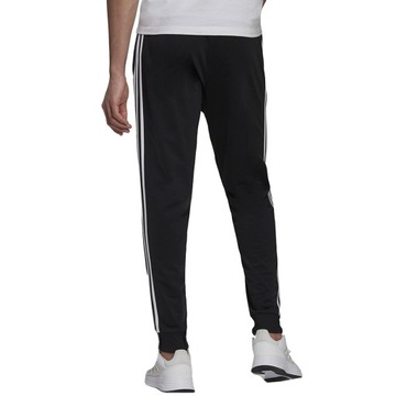 L Spodnie męskie adidas Primegreen Essentials Warm-Up Tapered 3-Stripes Tra