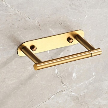 Держатель для рулонов туалетной бумаги. Современная массивная подставка для хранения из матового золота.