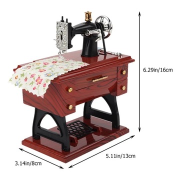 Mechaniczna pozytywka w kształcie maszyny do szycia