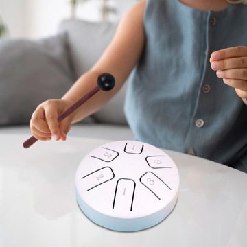 Развивающие игрушки со стальным язычком белого цвета.