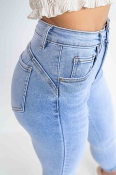 Dopasowane spodnie damskie jasne jeansy PUSH UP podwijane nogawki XL