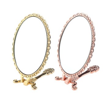 Винтажное ручное зеркало для макияжа из нержавеющей стали.