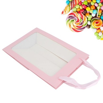 Большой бумажный пакет конфет. Открытое окно.