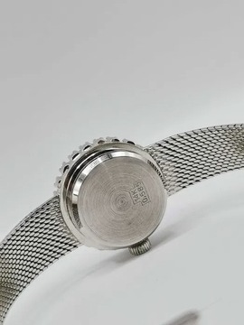 Damski złoty zegarek szwajcarski z białego złota z brylantami.