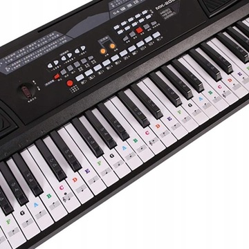 Наклейки с музыкальными нотами на клавишах фортепиано в цвете