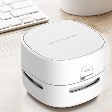 Маленький, энергосберегающий настольный пылесос для детей.