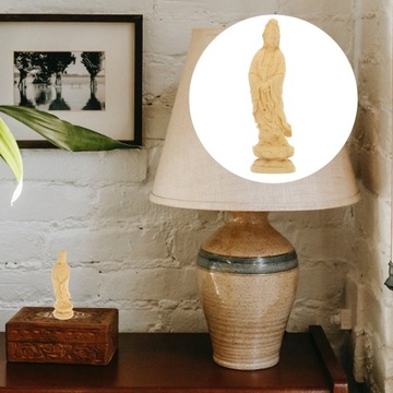 Украшение стола статуей богини Гуань Инь