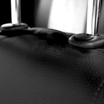 Универсальные чехлы на автомобильные сиденья из черной кожи.