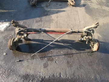 BELKA OŚ ZAWIESZENIA TYŁ TYLNA PEUGEOT 206 BĘBNY 1998 - 2009