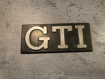 Emblemat VW GOLF MK1 GTI ORYGINAŁ 171853679
