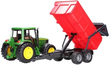 Трактор John Deere 6920 с красным прицепом