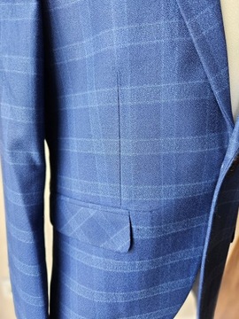 Куртка в клетку темно-синего цвета для мальчика 7 лет.