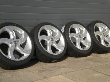 NOVÉ KOLA LETNÍ HLINÍK 18 4X100 OPEL CORSA D E ČIDLA CIS TPMS