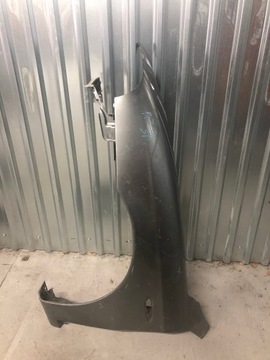 ALFA ROMEO 147 LIFT BŁOTNIK LEWY PRZEDNI 04-10R
