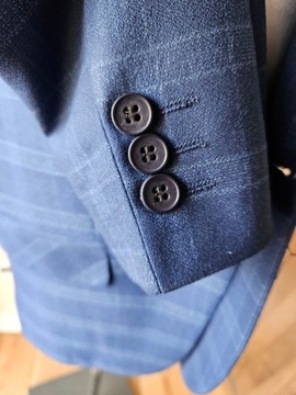 Куртка в клетку темно-синего цвета для мальчика 7 лет.