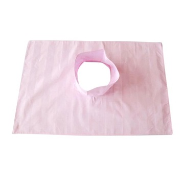 Massage table cover with a hole for