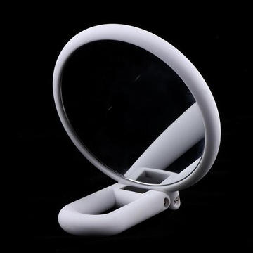 Двустороннее зеркало с увеличением в 15 раз.