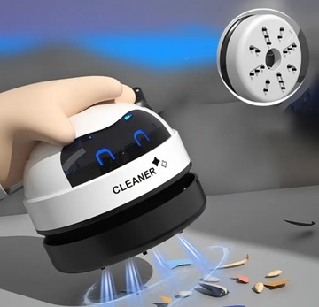 мини-робот пылесосит стол