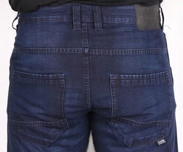 LUŹNE Jack Jones JEANSY granatowe ANTI FIT + 32/34