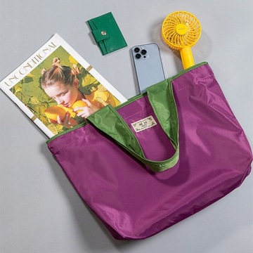 Большая многоразовая сумка для покупок на шнурке.