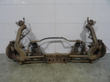 TOYOTA AVENSIS T25 OŚ BELKA TYŁ SANKI KOŁYSKA