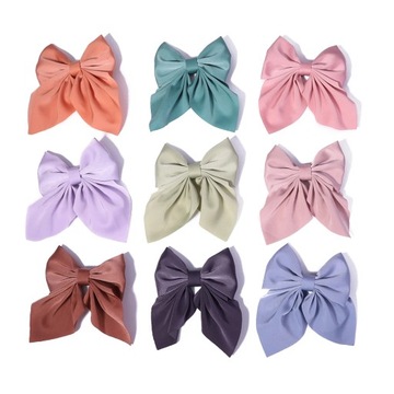 Зажим для волос-бантик, большой, модный, элегантный бант на бежевой застежке.