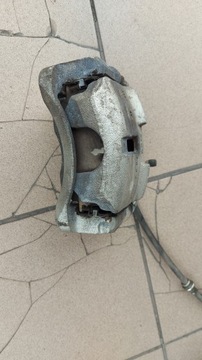 Zacisk lewy przód NISSAN QASHQAI II J11