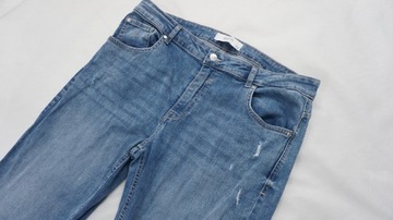 RESERVED spodnie jeansy z przetarciami r 44