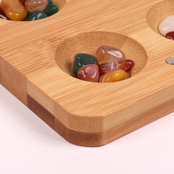 Складная деревянная настольная игра и 65 разноцветных камней.