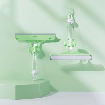 Зеленый скребок для мытья окон.