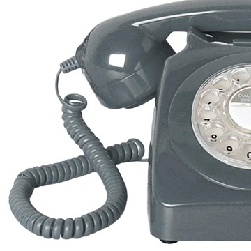 Стационарный телефон в стиле ретро. Телефон с дисковым набором номера в винтажном стиле, серый.