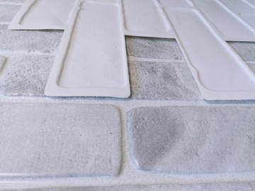 Стеновая панель из ПВХ старого кирпича серого цвета