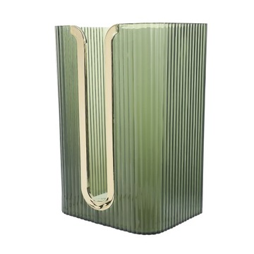 Золотые держатели для бумажных полотенец на стене.