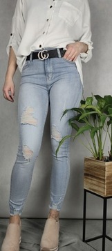 Spodnie jeans rurki z przetarciami dziurami 38